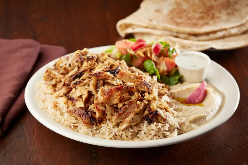 Chicken shawarma platter with rice, hummus, salad and bread